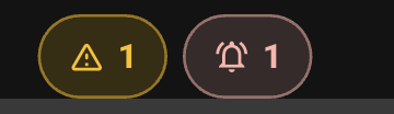 Two small rounded alert buttons at the top of the console: an amber one for routine items and a red one for urgent ones.